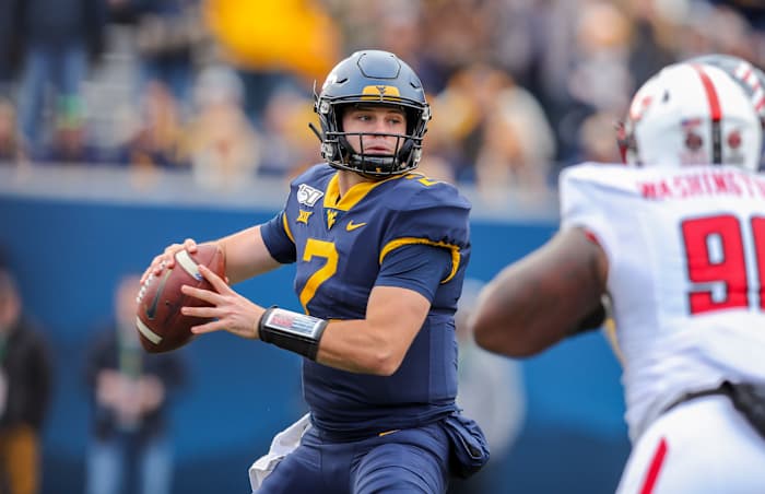 West Virginia Mountaineers quarterback Jarret Doege (2) throws a pass during the third quarter against the Texas Tech Red Raiders at Mountaineer Field at Milan Puskar Stadium.